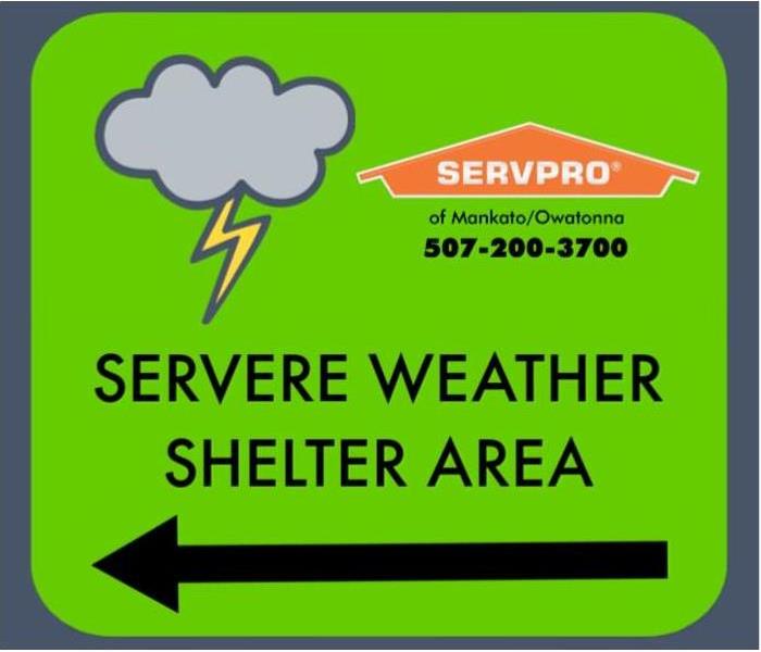 Sign stating "Severe weather shelter area" with SERVPRO logo and cloud with lightening bolt