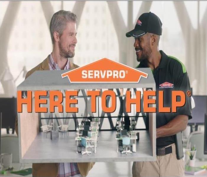 A SERVPRO Technicians is helping a client